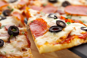 Calabrian pizza recipe with spicy salami, provola cheese and black olives